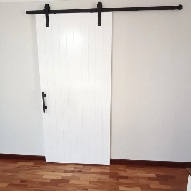 White barn door on a black track