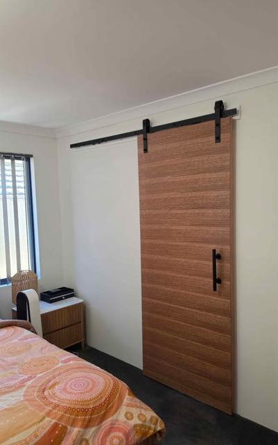 Timber barn door in a bedroom