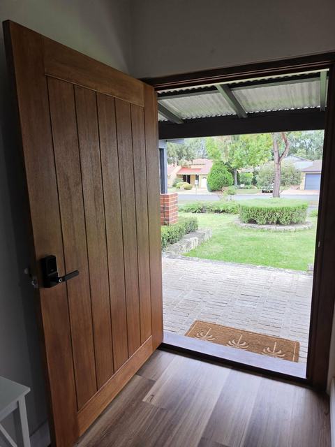 Timber front door with side light