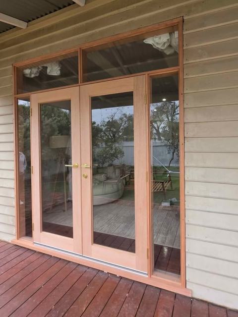 Timber French doors with transom windows