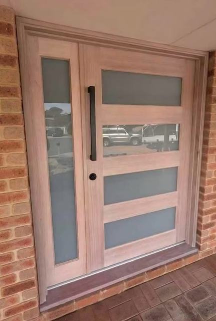 Timber entry door with frosted glass and side light