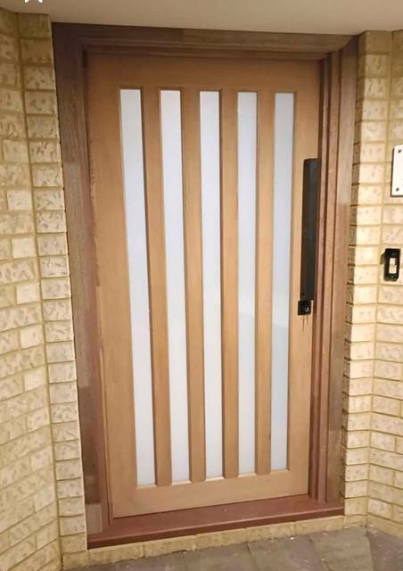 Timber entry door with five glass slots
