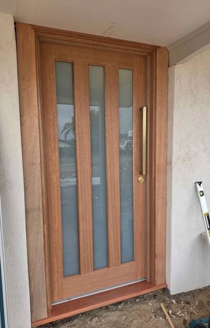 Timber door with three glass strips