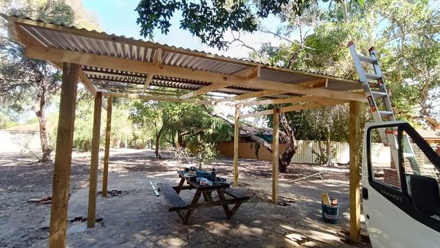Timber pergola with a clear roof