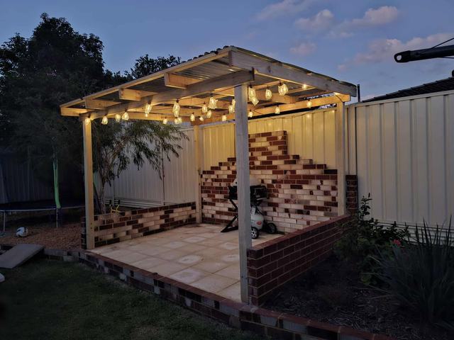 Finished pergola over a paved area