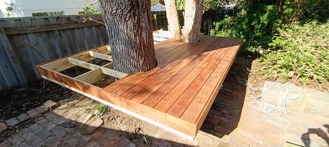 Finished deck built around a tree