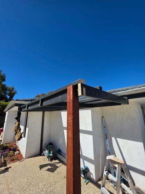 Patio roof frame going up