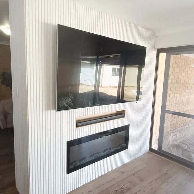 TV and fireplace feature wall with panelling