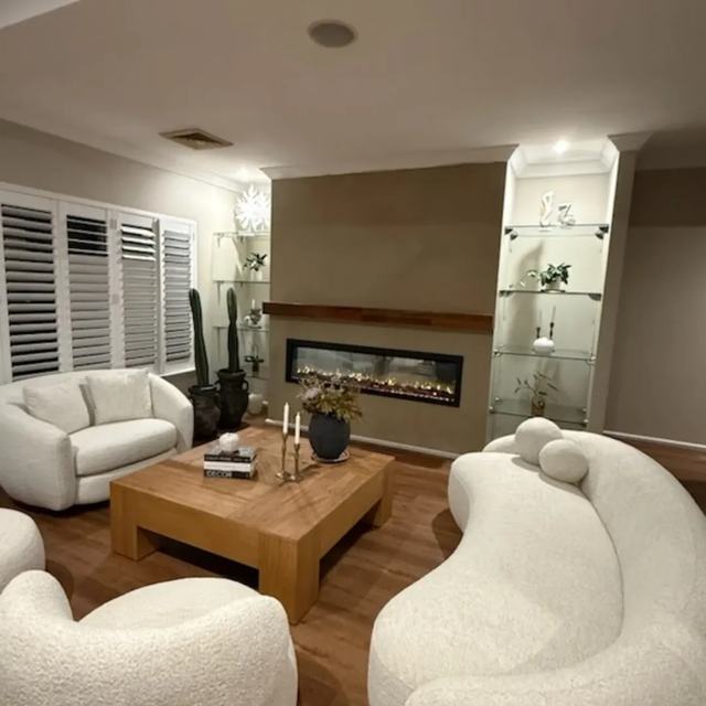 Living room with finished fireplace wall